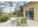 Outdoor table with seating on screened patio at 663 Shorehaven Dr, Poinciana, FL 34759