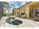 Screened-in pool with attached spa and a seating area on the pool deck, great for entertaining or relaxing outdoors at 663 Shorehaven Dr, Poinciana, FL 34759