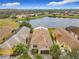 Several houses near a lake showcasing community living at 669 Grand Canal Dr, Kissimmee, FL 34759