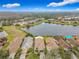 Aerial of homes with lake and conservation areas in the background at 669 Grand Canal Dr, Kissimmee, FL 34759