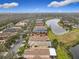 Aerial view of houses and a lake at 669 Grand Canal Dr, Kissimmee, FL 34759