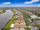 Community with lakefront homes and lush landscaping at 669 Grand Canal Dr, Kissimmee, FL 34759