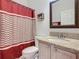Bathroom with granite countertop and updated fixtures at 669 Grand Canal Dr, Kissimmee, FL 34759