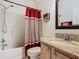Clean bathroom with granite countertop and updated fixtures at 669 Grand Canal Dr, Kissimmee, FL 34759