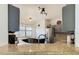 Modern kitchen features granite countertops, stainless steel appliances, and dark gray cabinets at 669 Grand Canal Dr, Kissimmee, FL 34759
