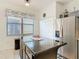 Kitchen island with black countertop and breakfast bar at 669 Grand Canal Dr, Kissimmee, FL 34759
