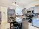 Modern kitchen with stainless steel appliances and island at 669 Grand Canal Dr, Kissimmee, FL 34759