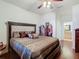 King-size bed in large bedroom, with large closet and bathroom access at 669 Grand Canal Dr, Kissimmee, FL 34759