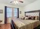 Spacious main bedroom with king-size bed and large windows at 669 Grand Canal Dr, Kissimmee, FL 34759