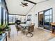 Spacious screened porch with tiled floor, ceiling fan and outdoor furniture at 669 Grand Canal Dr, Kissimmee, FL 34759