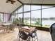 Bright sunroom with lake view, furnished for comfortable living at 669 Grand Canal Dr, Kissimmee, FL 34759
