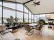 Relaxing sunroom with lake view, equipped with ceiling fan at 669 Grand Canal Dr, Kissimmee, FL 34759