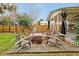 Backyard features a cozy seating area with fire pit and ample space for gatherings at 723 New York Ave, St Cloud, FL 34769
