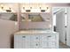 Elegant bathroom with a double vanity, marble countertop, framed mirrors, and designer lighting fixtures at 723 New York Ave, St Cloud, FL 34769