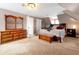 Cozy bedroom features a comfortable bed, dresser, and a chest creating a relaxing retreat at 723 New York Ave, St Cloud, FL 34769
