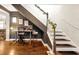 Dedicated home office area near the staircase with hardwood floors and stylish decor at 723 New York Ave, St Cloud, FL 34769