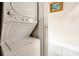 Efficient stacked washer and dryer provide laundry convenience with easy-to-use controls in a well-lit space at 723 New York Ave, St Cloud, FL 34769