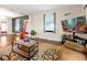 Cozy living room featuring hardwood floors and entertainment area with a large TV at 723 New York Ave, St Cloud, FL 34769