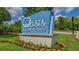 Oasis Clubhouse sign at ChampionsGate, featuring landscaping at 771 Drop Shot Dr, Davenport, FL 33896