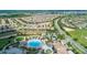 Community overview showcasing homes, landscape, and resort-style pool at 771 Drop Shot Dr, Davenport, FL 33896