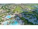 Bird's-eye view of the community, highlighting the expansive pool and golf course at 771 Drop Shot Dr, Davenport, FL 33896