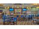 Community bar with seating and large screens at 771 Drop Shot Dr, Davenport, FL 33896