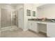 Spa-like bathroom with double vanity and walk-in shower at 771 Drop Shot Dr, Davenport, FL 33896