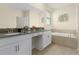 Bathroom with double vanity, soaking tub, and separate shower at 771 Drop Shot Dr, Davenport, FL 33896