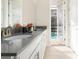 Double vanity bathroom with pool view at 771 Drop Shot Dr, Davenport, FL 33896