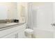 Clean bathroom with a tub, shower, and gray countertop vanity at 771 Drop Shot Dr, Davenport, FL 33896