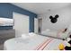 Bedroom with two twin beds and a TV at 771 Drop Shot Dr, Davenport, FL 33896