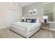Bright bedroom featuring a king-size bed and stylish furnishings at 771 Drop Shot Dr, Davenport, FL 33896