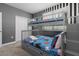 Bedroom with bunk beds and Mickey Mouse decor at 771 Drop Shot Dr, Davenport, FL 33896