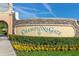 ChampionsGate community entrance with landscaping and signage at 771 Drop Shot Dr, Davenport, FL 33896