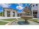 Elegant fountain in the center of the Oasis Clubhouse courtyard at 771 Drop Shot Dr, Davenport, FL 33896