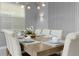 Elegant dining room featuring a wood table and neutral decor at 771 Drop Shot Dr, Davenport, FL 33896