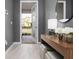 Bright and airy entryway with contemporary console table and mirror at 771 Drop Shot Dr, Davenport, FL 33896