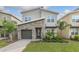 Two-story home with stone accents and a two-car garage at 771 Drop Shot Dr, Davenport, FL 33896