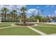 Landscaped courtyard with a multi-tiered fountain at 771 Drop Shot Dr, Davenport, FL 33896