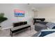 Game room with TV, comfy seating, and foosball table at 771 Drop Shot Dr, Davenport, FL 33896