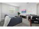 Game room features a comfortable sofa, foosball table, and large TV at 771 Drop Shot Dr, Davenport, FL 33896