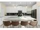 Modern kitchen with island and stainless steel appliances at 771 Drop Shot Dr, Davenport, FL 33896