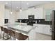 Modern kitchen with island and stainless steel appliances at 771 Drop Shot Dr, Davenport, FL 33896