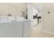 Bright laundry room with washer, dryer, and overhead storage at 771 Drop Shot Dr, Davenport, FL 33896