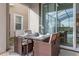 Wicker patio furniture set for four with a view of the pool at 771 Drop Shot Dr, Davenport, FL 33896