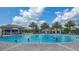 Resort-style circular pool with palm trees and a swim-up bar at 771 Drop Shot Dr, Davenport, FL 33896