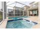 Bubbly spa and refreshing pool in a screened enclosure at 771 Drop Shot Dr, Davenport, FL 33896