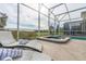 Relaxing spa with lounge chairs and a view of the pool at 771 Drop Shot Dr, Davenport, FL 33896