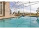 Inviting swimming pool with spa and screened enclosure, perfect for outdoor relaxation at 771 Drop Shot Dr, Davenport, FL 33896
