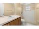 Bathroom featuring single sink vanity and walk-in shower at 83 Alameda Dr, Kissimmee, FL 34743